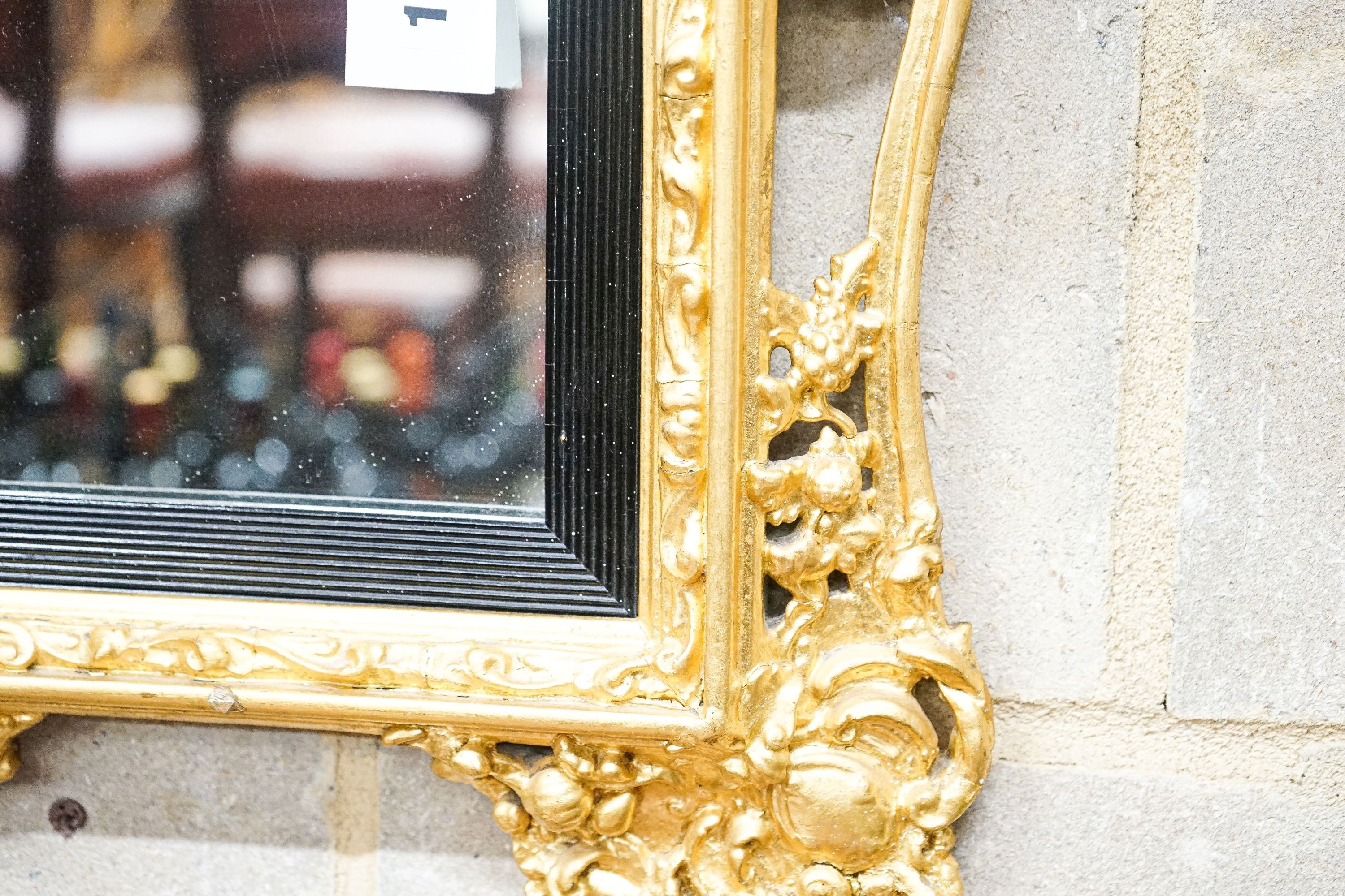 A Victorian gilt gesso wall mirror, width 58cm, height 66cm